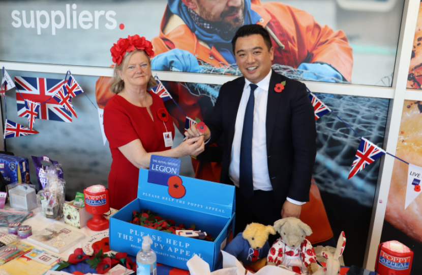 Alan Mak MP buys a poppy from Havant Poppy Appeal organiser Anne Newcombe