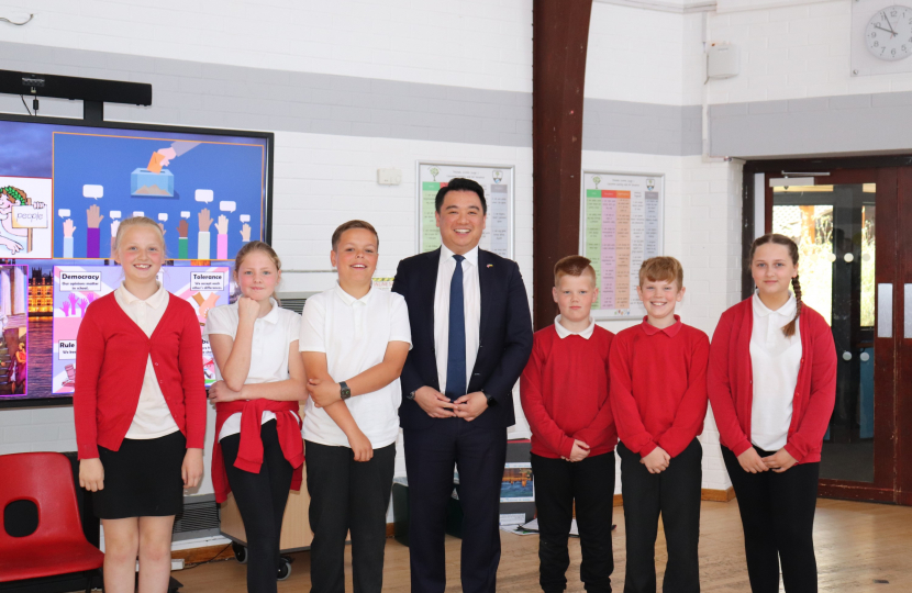 Local MP Alan Mak with pupils at Trosnant Junior School