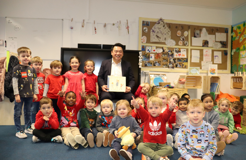 Local MP Alan Mak reads We’re Going on a Bear Hunt to the children at St. Thomas More’s Catholic School and Nursery
