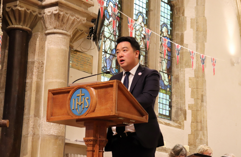 Local MP Alan Mak gives a reading of the prayers of intercession at the service 