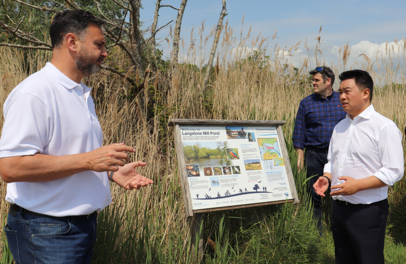 Photo: Alan Mak MP inspects the Langstone Mill Pond and surrounding area with Lyall Cairns, Head of Coastal Partners.