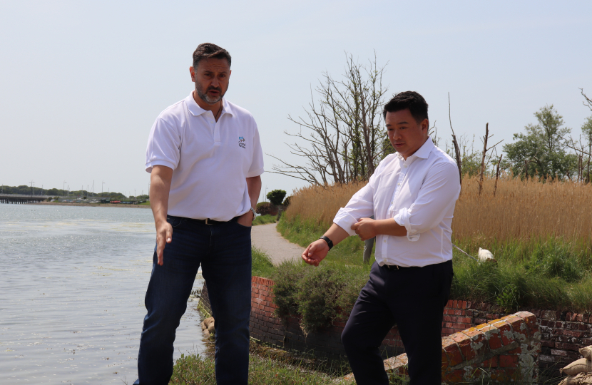 Photo: Alan Mak MP inspects the Langstone Mill Pond and surrounding area with Lyall Cairns, Head of Coastal Partners.
