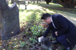 Local MP Alan Mak reflects on the victims of the Holocaust at the Holocaust Memorial in Havant Cemetery.