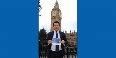 Alan Mak MP with his Cost of Living Guide after successfully campaigning in Westminster for the payments to be delivered. 
