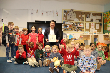 Local MP Alan Mak reads We’re Going on a Bear Hunt to the children at St. Thomas More’s Catholic School and Nursery