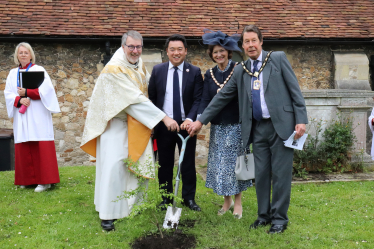 Local MP Alan Mak joins Tom Kennar and Diana Patrick in planting a Hawthorne Tree in the church gardens 
