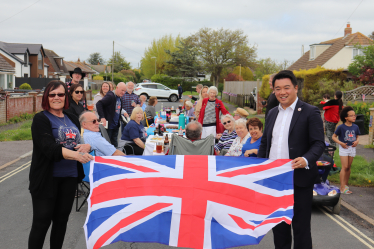 Local MP Alan Mak presents Angela Hopkins with a Union flag